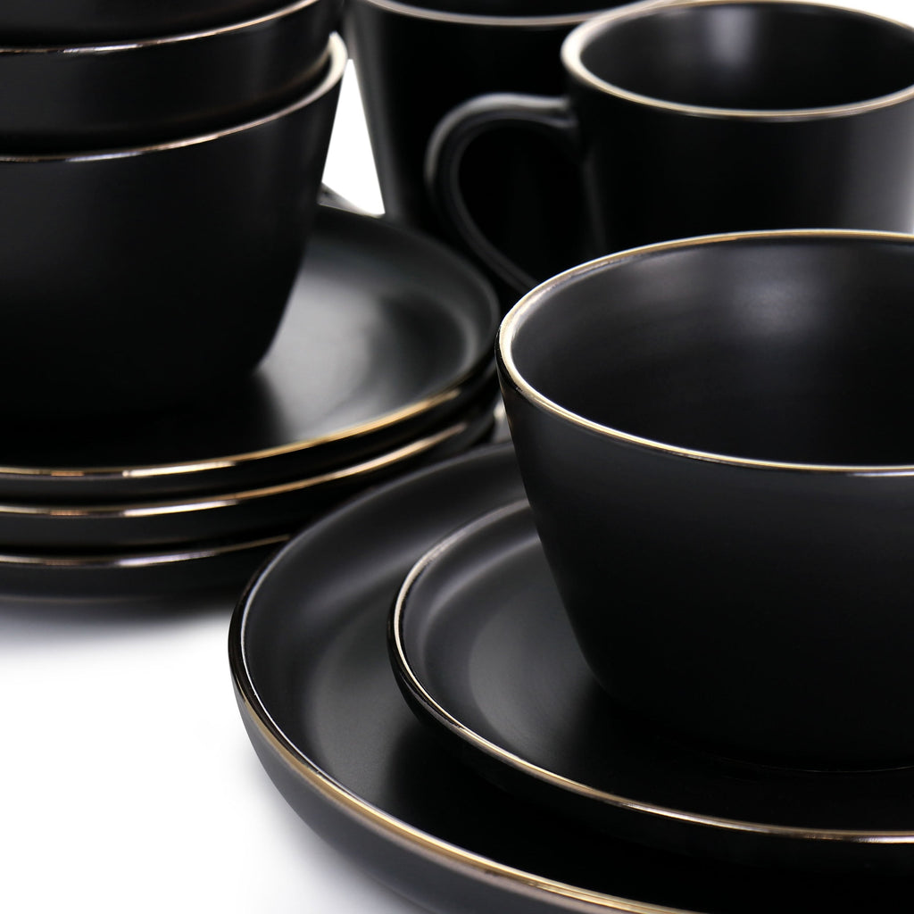 Service de table 16 pièces en grès noir avec bordure dorée